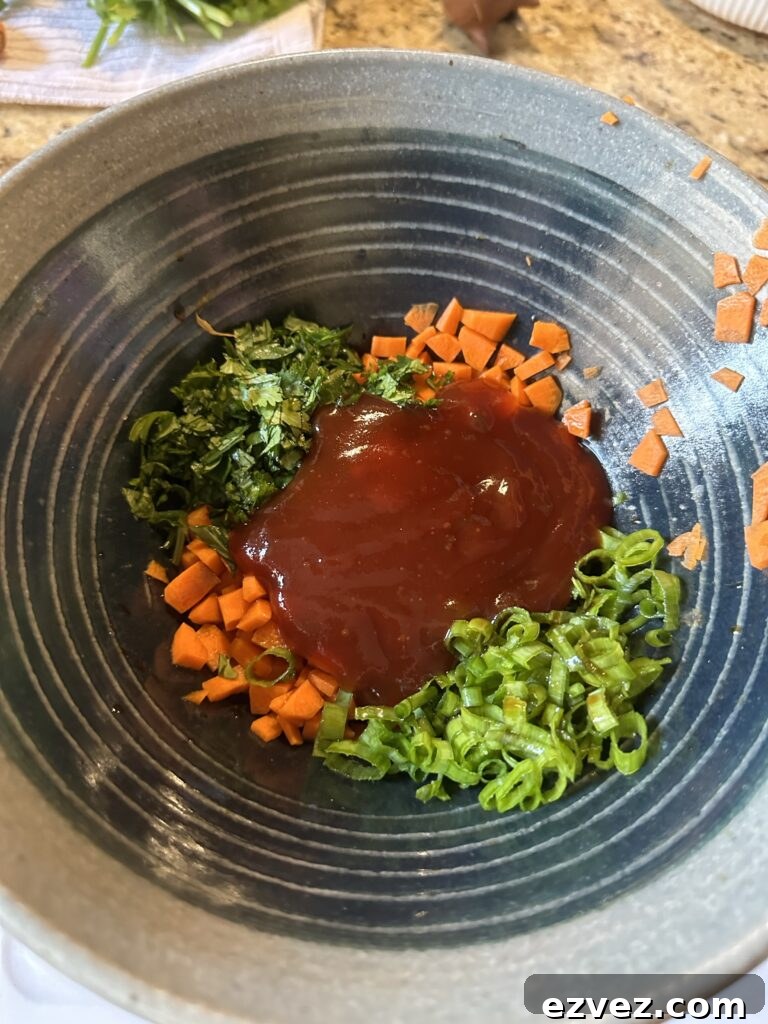 Chopped veggies topped with sweet and sour sauce