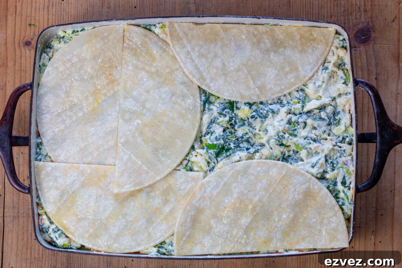Top with a second layer of corn tortillas