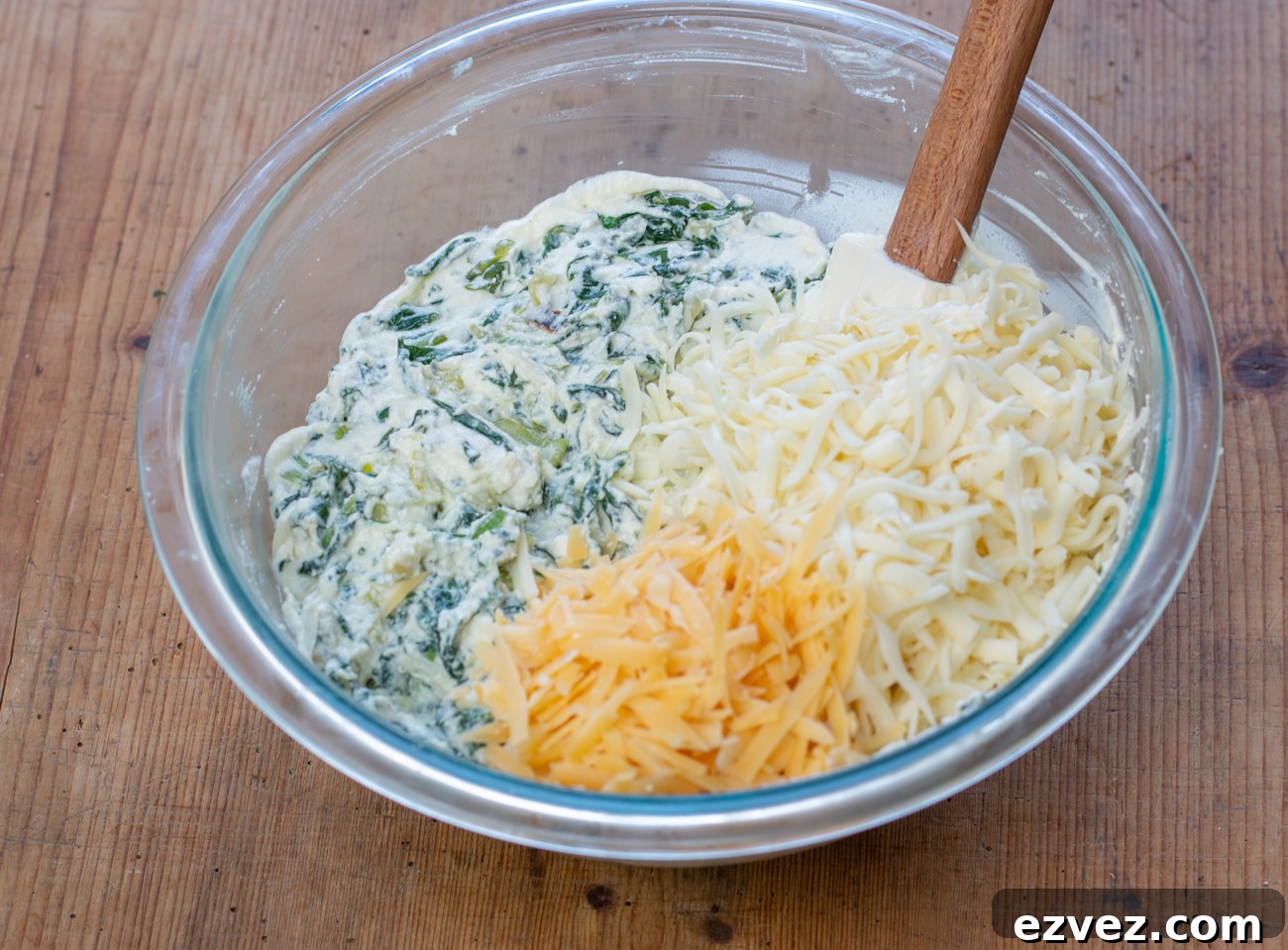 Stir in grated Monterey Jack and aged Gouda