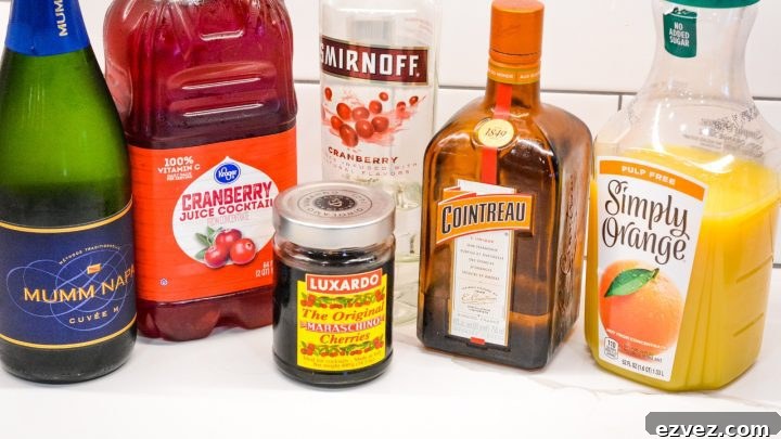 Cranberry Orange Champagne Cocktail is made from orange juice, cranberry juice, vodka, cointreau, champagne and Luxardo maraschino cherries.
