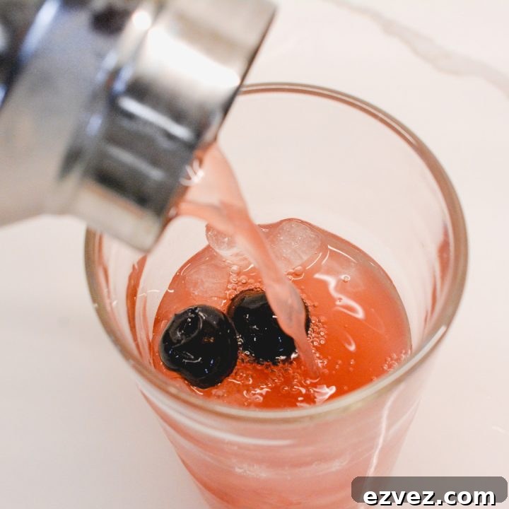 Pour the orange and cranberry cocktail base into cocktail glasses or champagne flutes. Then top each glass or flute with chilled prosecco or champagne.