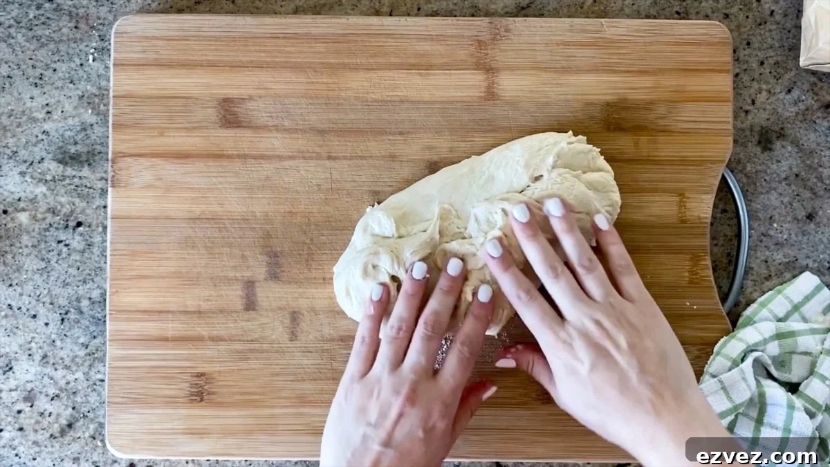 starting to stretch pizza dough by hand