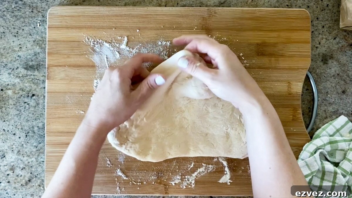 demonstrating pinching pizza dough crust