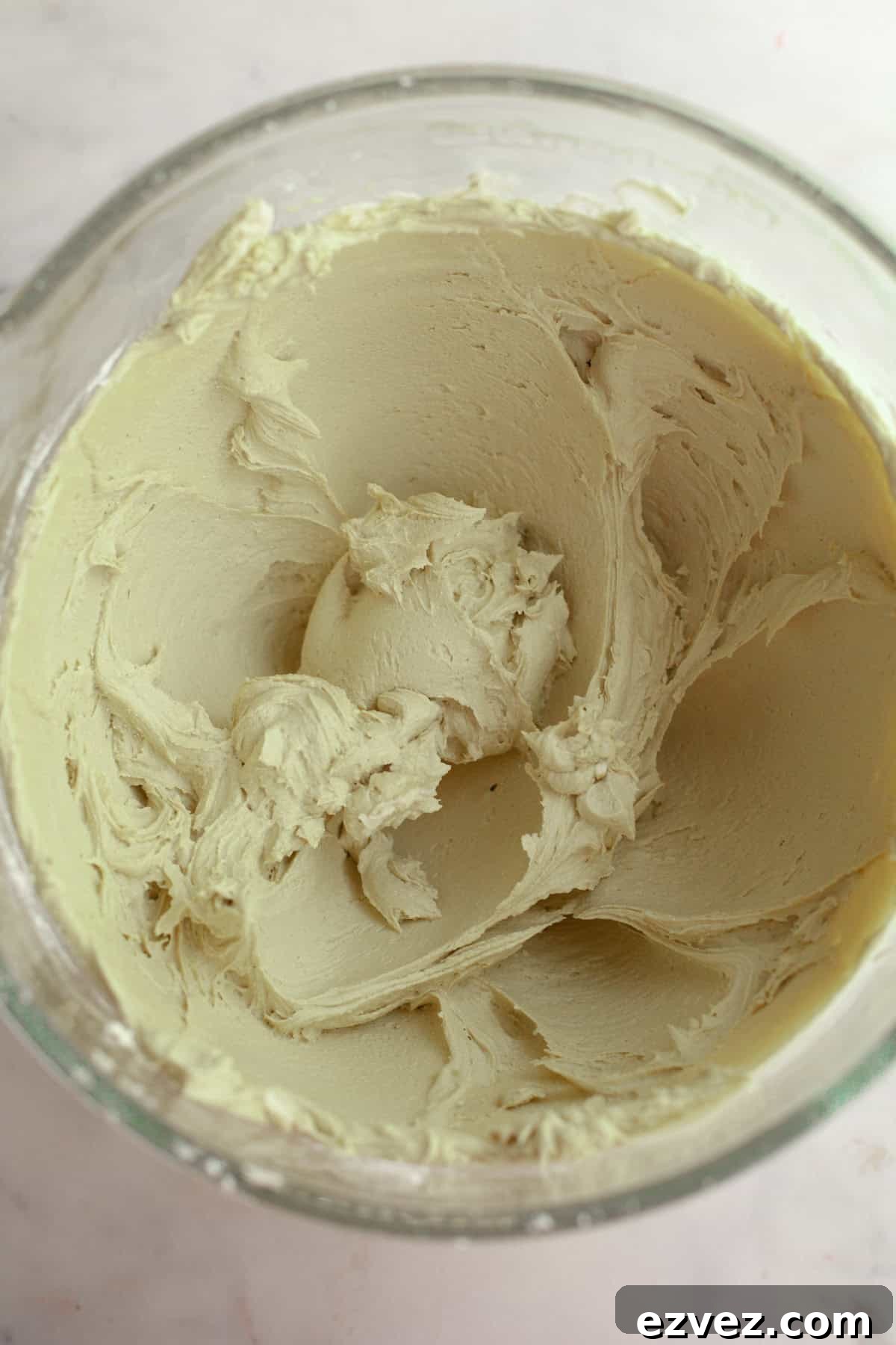 Pistachio frosting in a glass bowl.