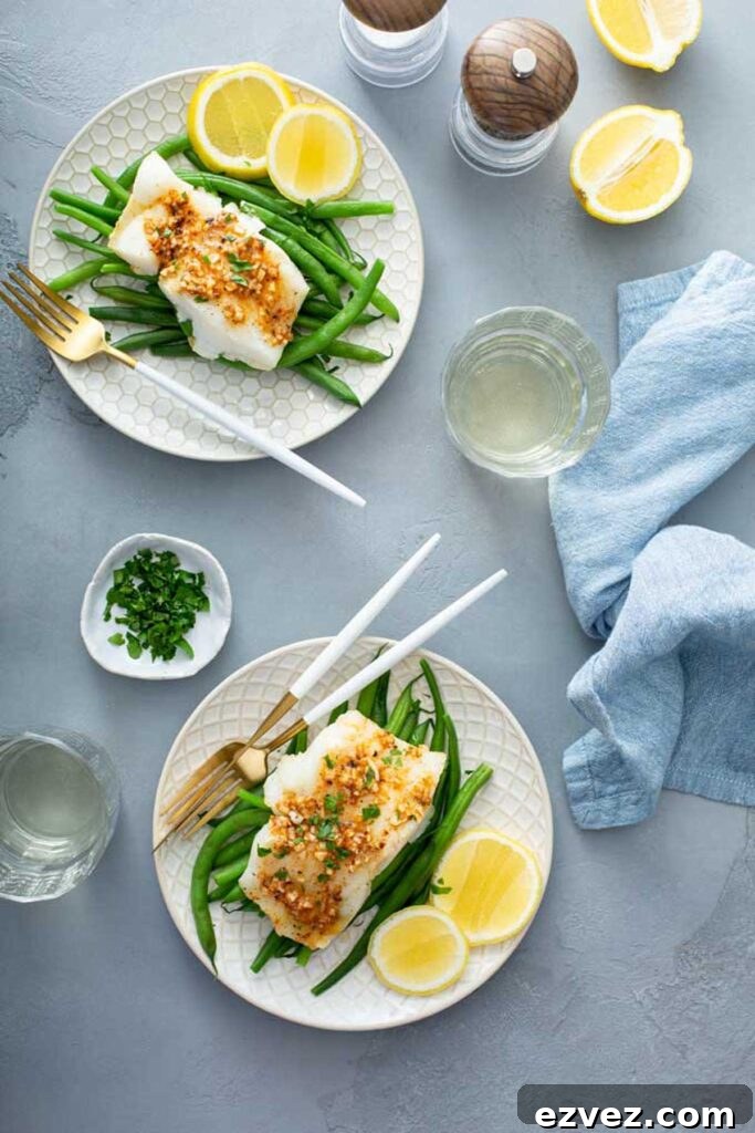 Easy baked cod fillets served over green beans