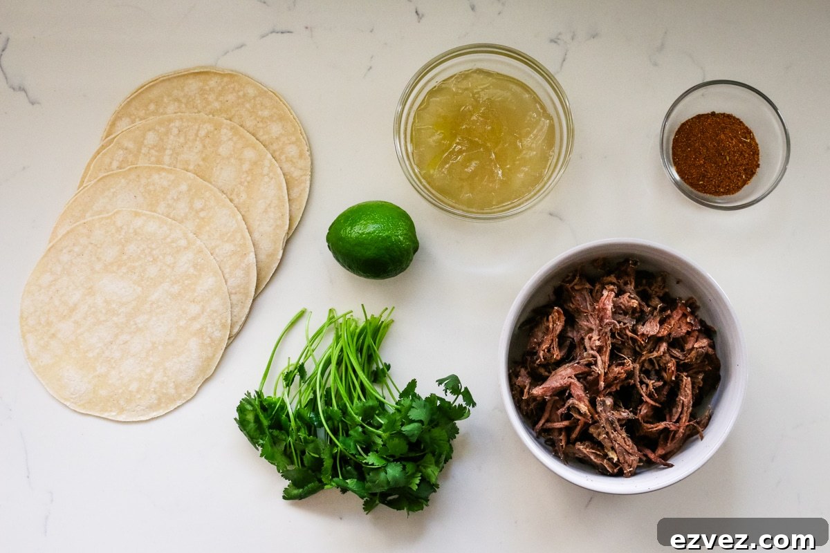 Slow-Cooker Shredded Beef Tacos for Flavorful Weeknight Meals 4 Ingredients for roast tacos on the table.