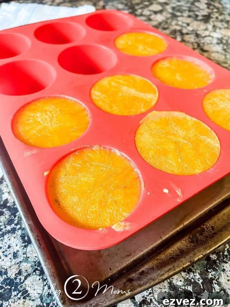 Silicone large muffin pan with frozen soup in the cups