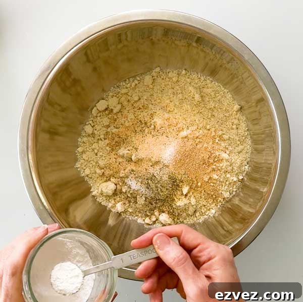 Adding the dry ingredients to a mixing bowl.