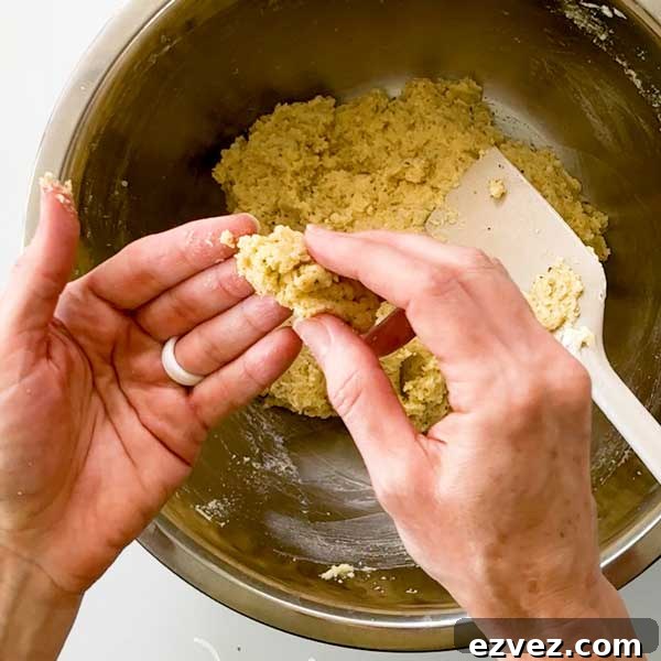 Testing the dough that should be slightly sticky when touched.