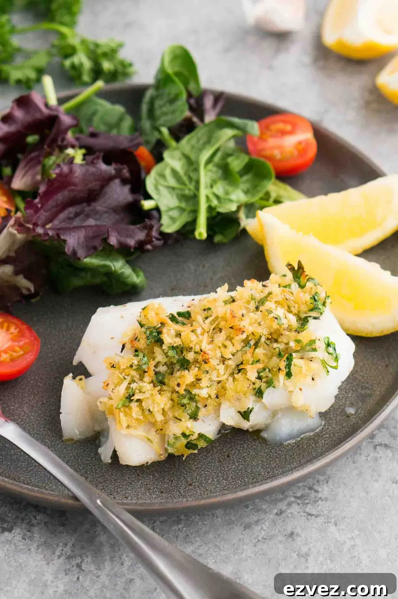 Crispy Oven-Baked Cod with Lemon and Garlic 7 oven baked cod with gremolata on a plate with salad
