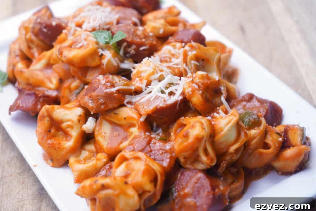 Tortwllini with sausage on plate