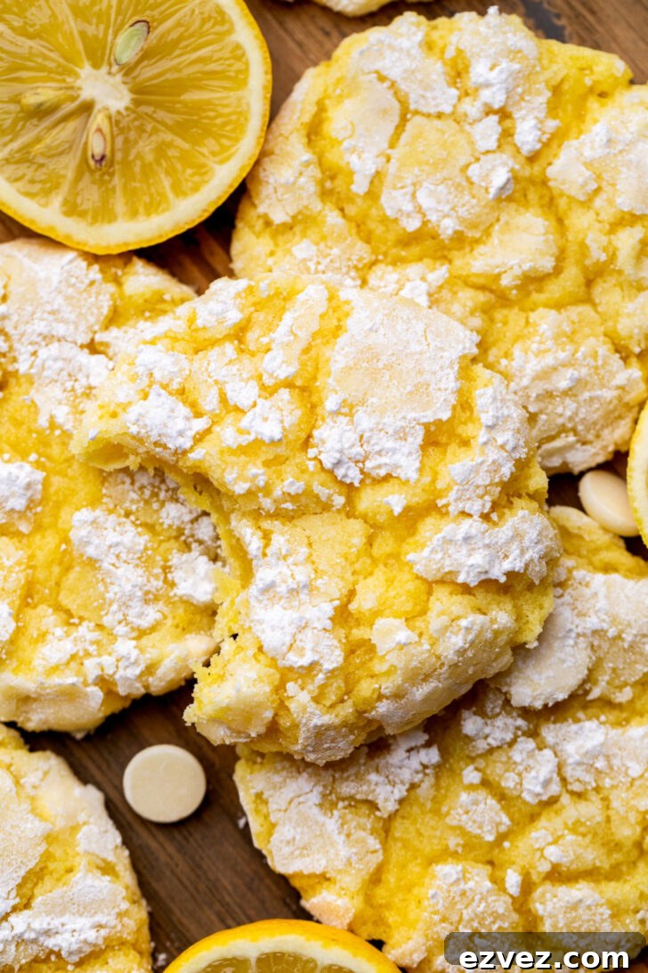 Top view of a lemon crinkle cookies missing a bite.