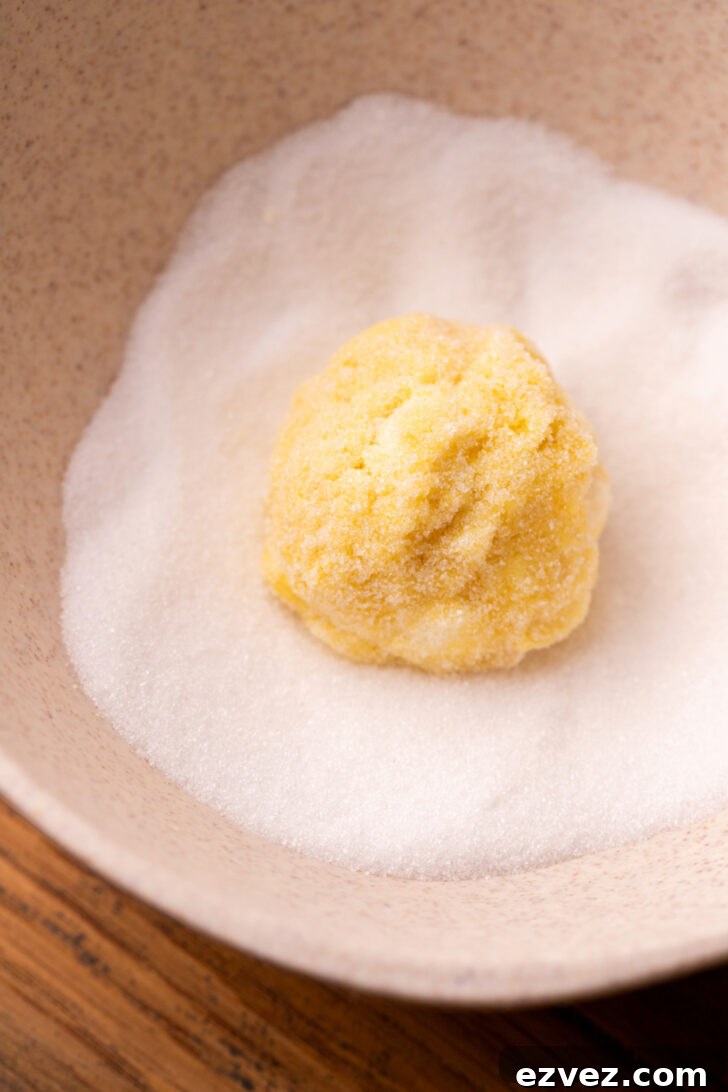 Cookie dough ball in sugar.