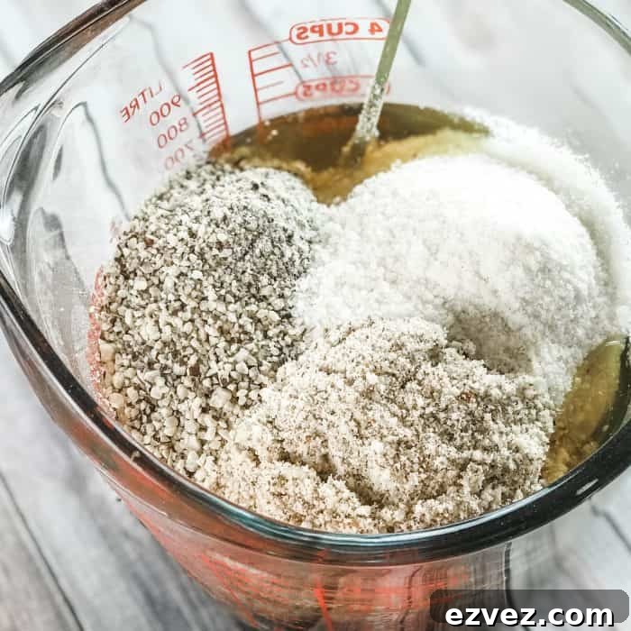 adding ground rice, almonds, and beans to melted cocoa butter and shea butter and lemon and lavender essential oils to make homemade Lush Buffy Bar with essential oils