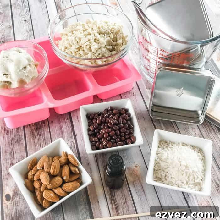 DIY Lush Buffy Bars ingredients and tools - lemon and lavender essential oils, cocoa butter and shea butter, almonds, rice, adzuki beans, silicone molds, Lush tins, measuring cups and bowls