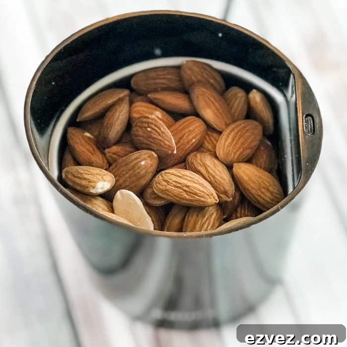 almonds, rice, and beans in metal jar, ready to grind into Lush Buffy Bar ingredient