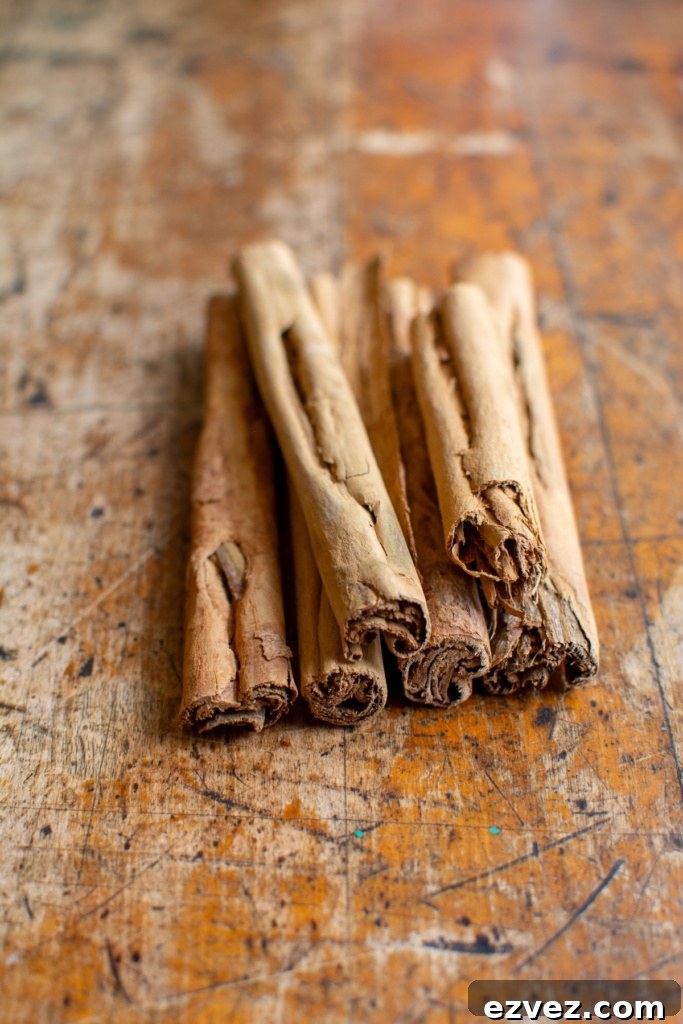 Several sticks of Ceylon cinnamon on a wood table