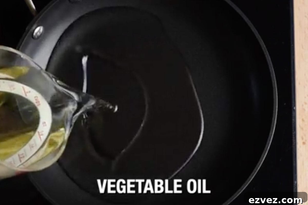 vegetable oil being poured in deep pan