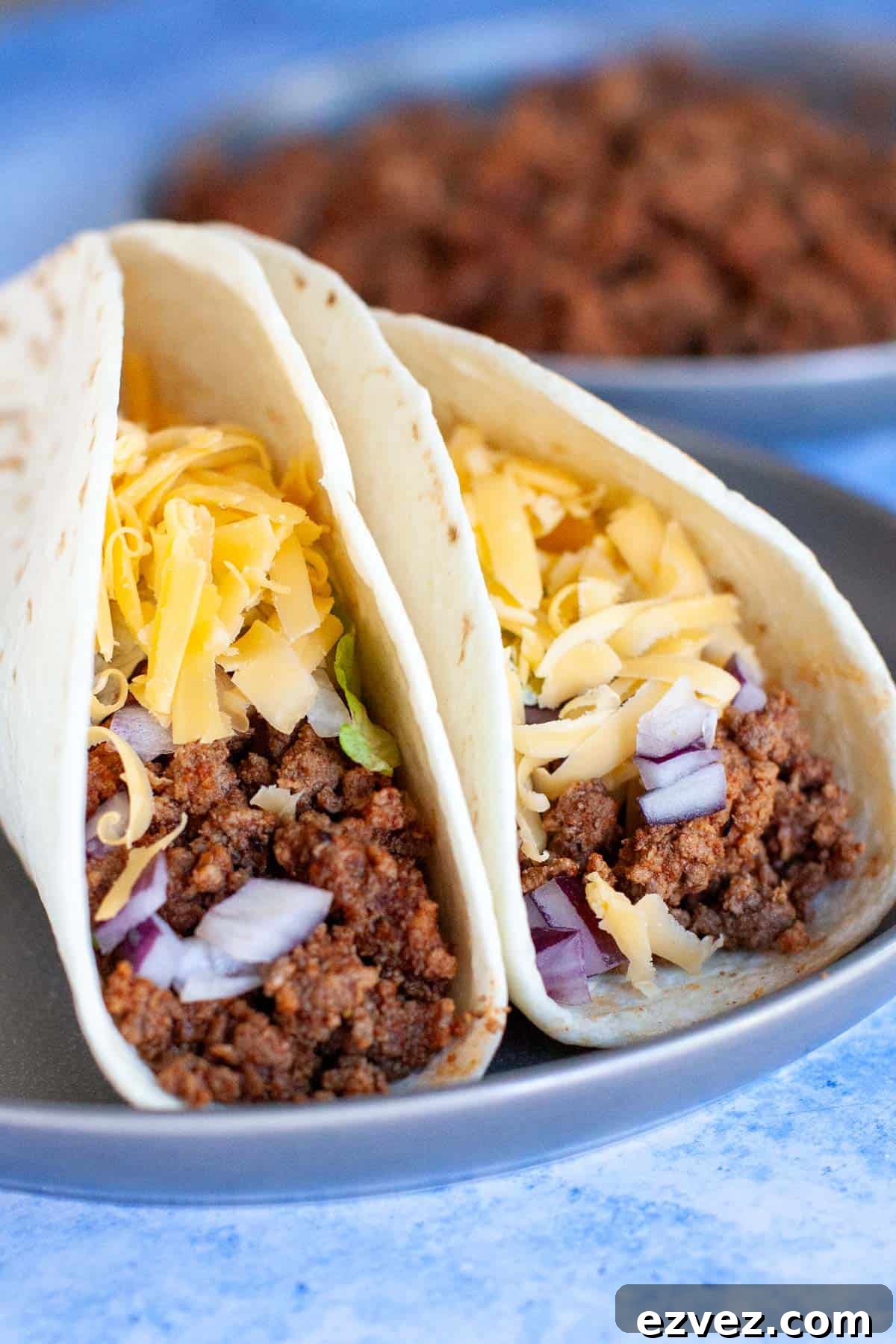 Ground beef tacos in flour tortillas.