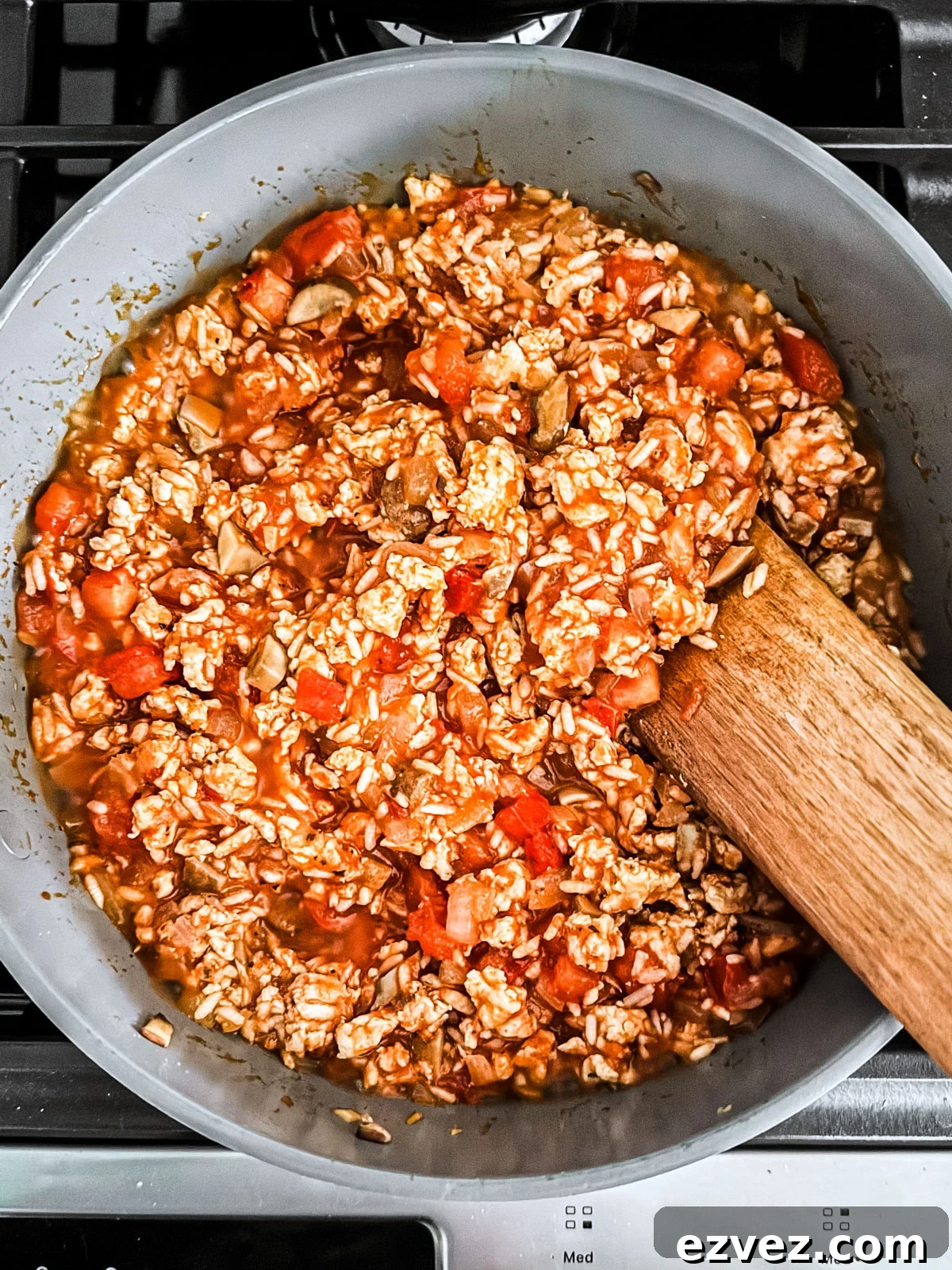 Turkey-Stuffed Bell Peppers with Savory Rice Filling 6 Tomatoes, ground turkey, and rice mixed together in a skillet.