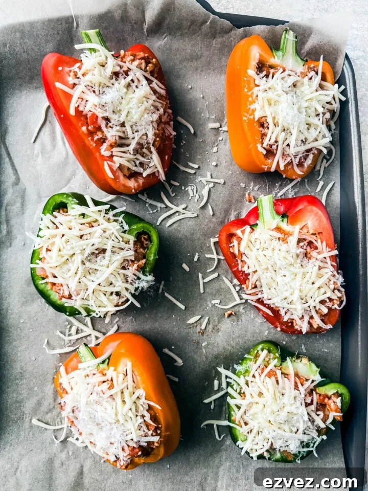 Turkey-Stuffed Bell Peppers with Savory Rice Filling 8 Peppers stuffed and topped with cheese prior to baking.