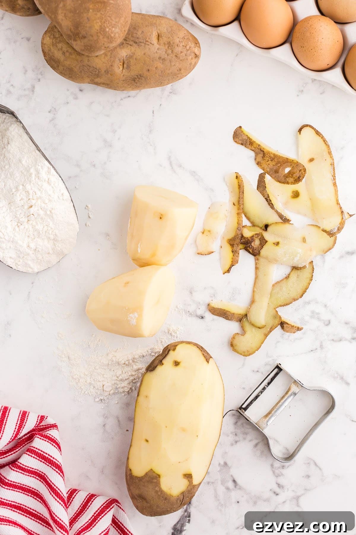 Peeling baking potatoes.
