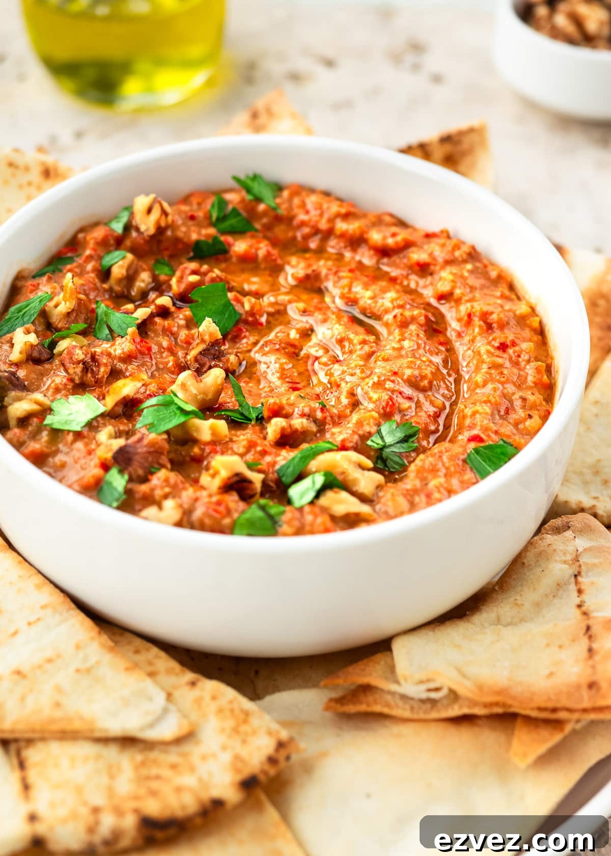 Bowl of M'hammara served with Pita chips.
