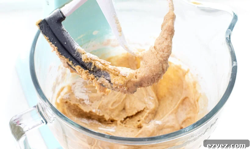 cake batter in stand mixer with paddle attachment