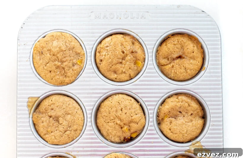 baked peach upside down cakes in muffin tin