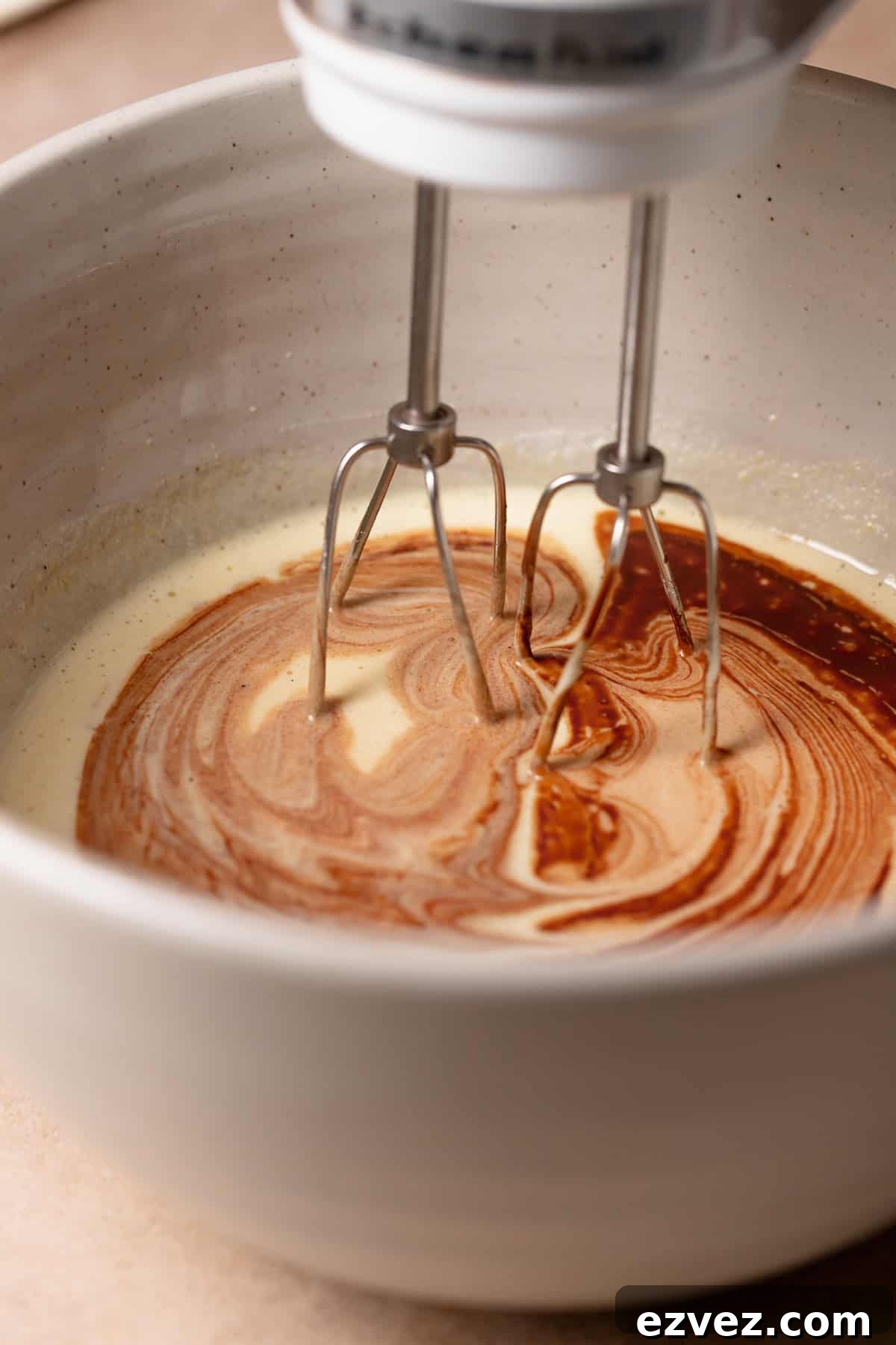 Fudgy Brown Butter Chocolate Brownie Cake Recipe 4 The melted chocolate being mixed into the beaten eggs and sugar.
