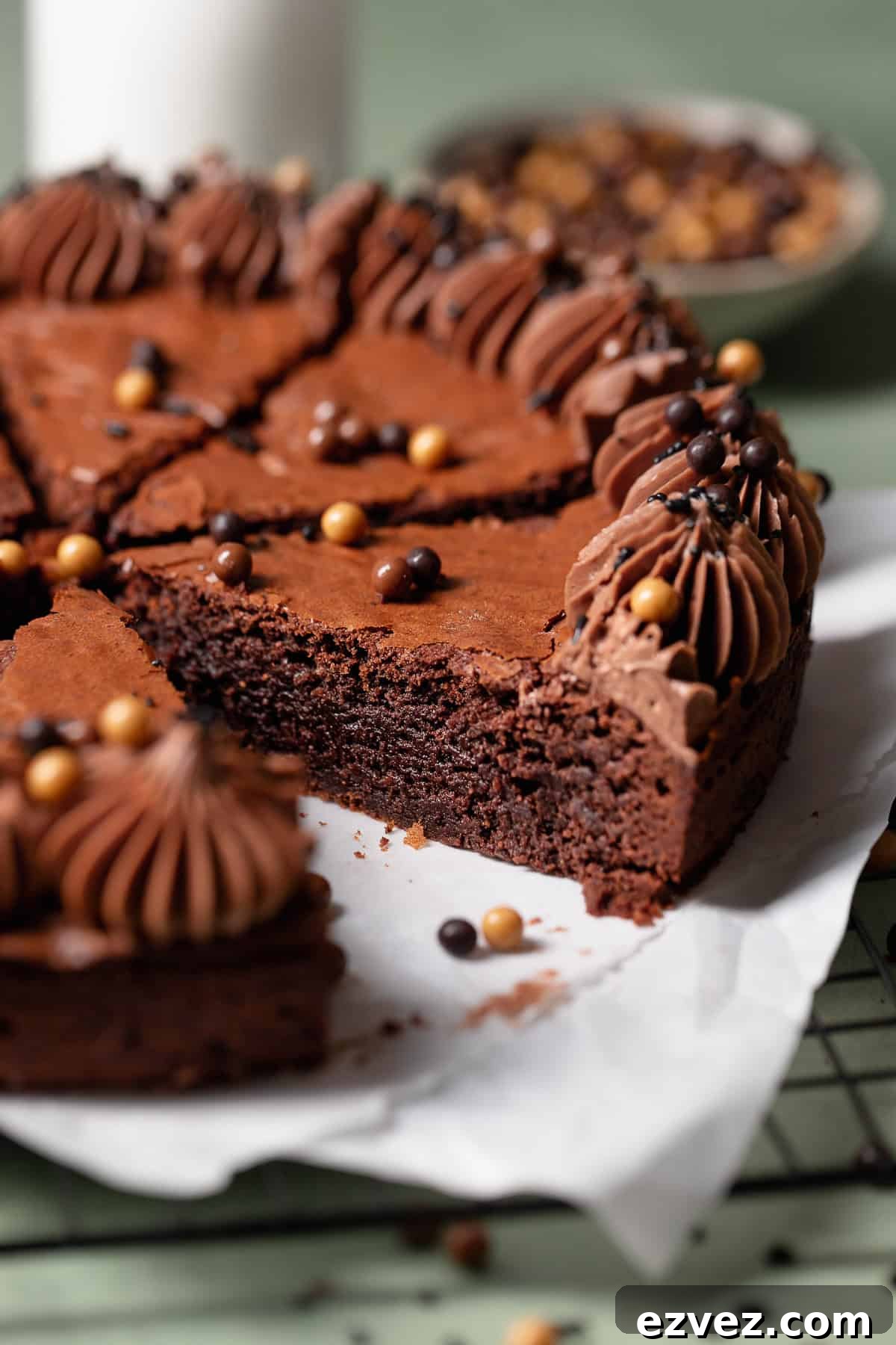 Fudgy Brown Butter Chocolate Brownie Cake Recipe 9 A piece of brownie cake pulled out to show the fudgy texture.
