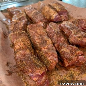 uncooked 4" strips of boneless country style ribs with a bbq rub added