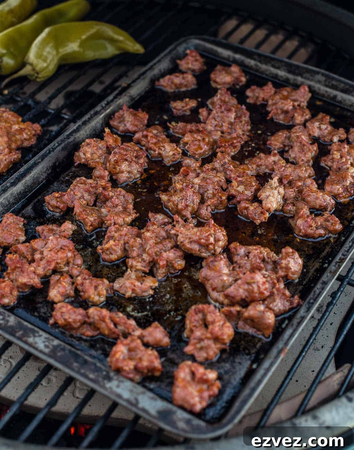 Smoked sausage on a baking sheet in the smoker