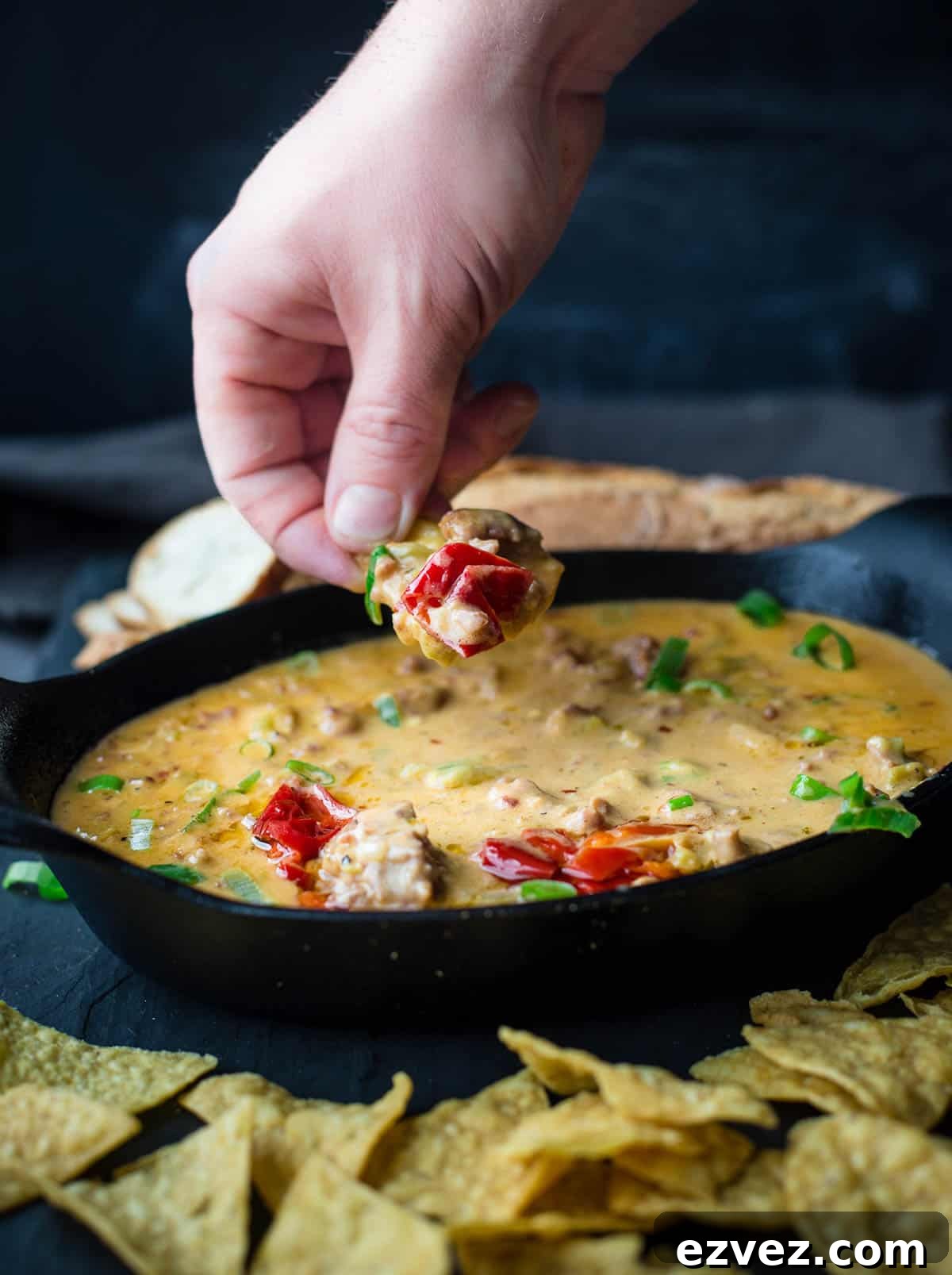 A spoonful of Smoked Sausage Beer Cheese Dip