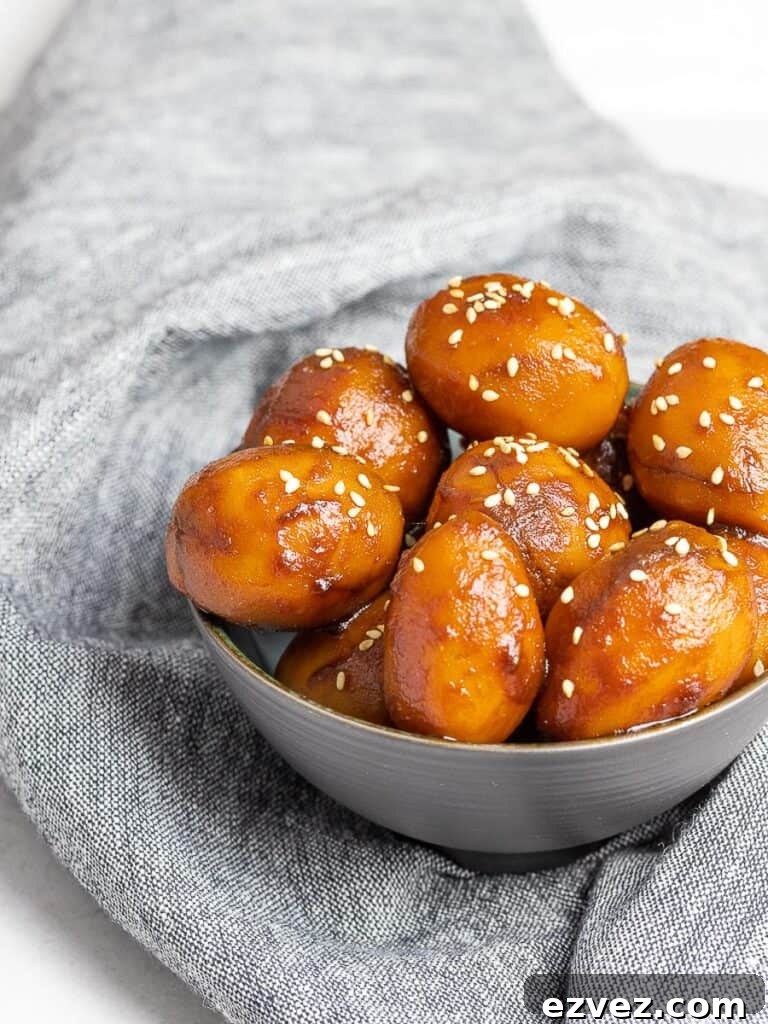 Korean Potato Side Dish, Gamja Jorim in a grey bowl on top of linen