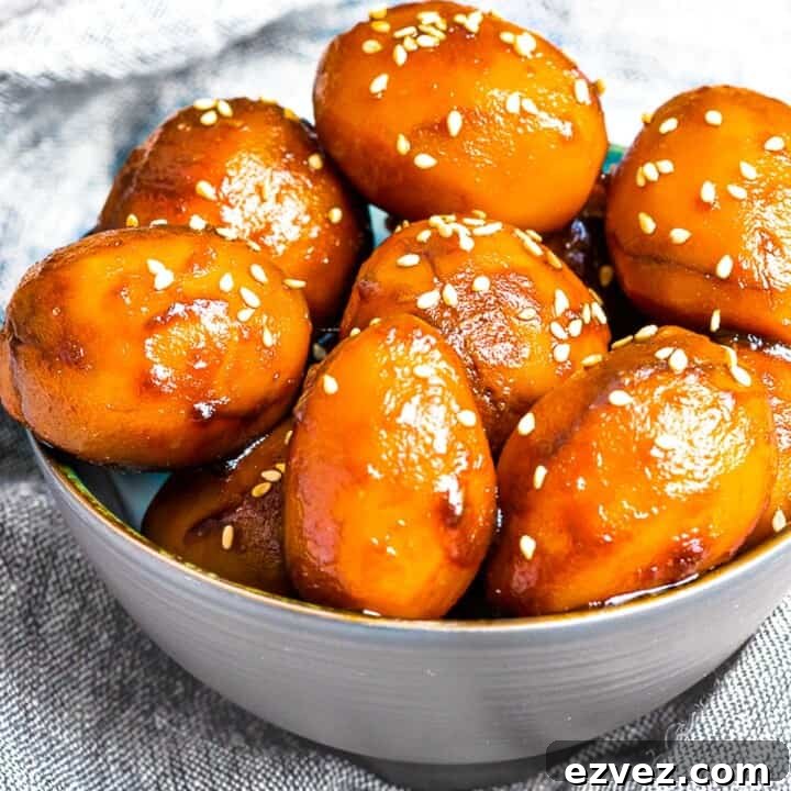 Korean Potato Side Dish, Gamja Jorim in a grey bowl on top of linen