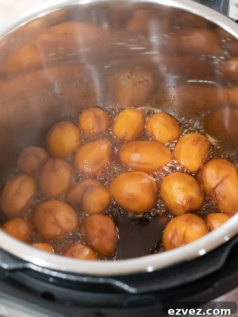 Korean Potato Side Dish, Gamja Jorim in a grey bowl on top of linen