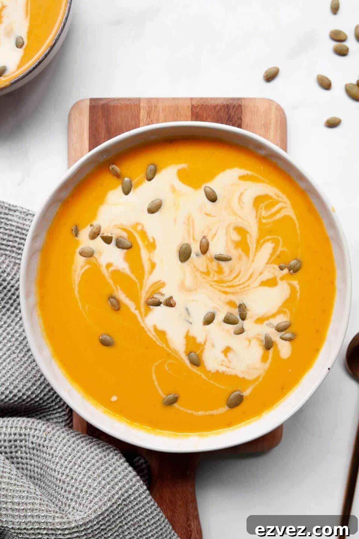 Creamy and cozy pumpkin sweet potato soup with coconut milk and pepitas.