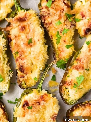Top down view of gluten-free jalapeño poppers on parchment.