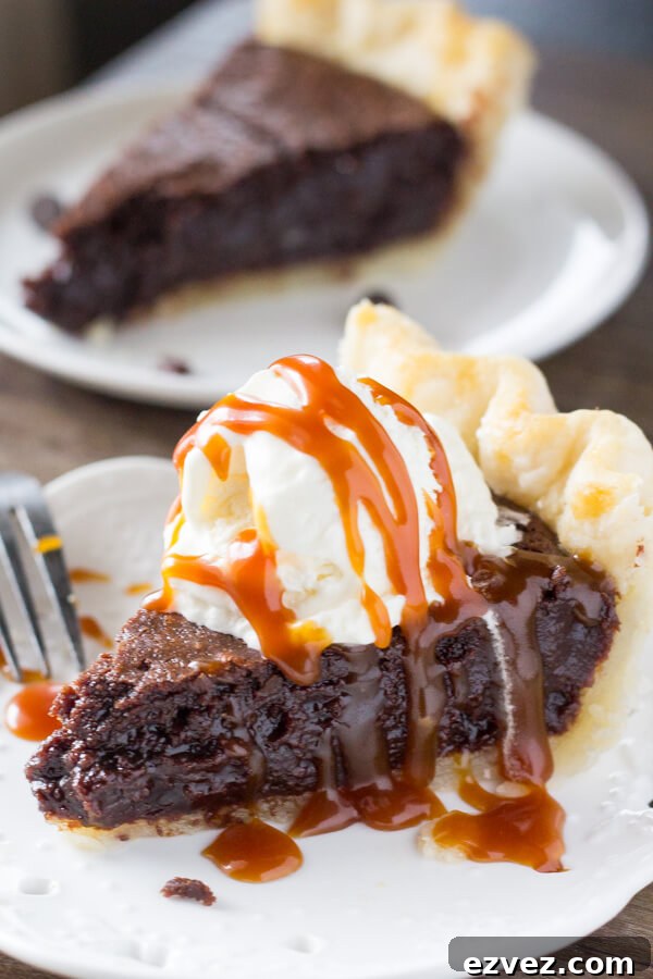 This easy, homemade Fudge Brownie Pie features a flaky, golden pie crust shell filled with the gooiest, fudgiest brownie. Serve it with ice cream & caramel sauce for the ultimate treat!