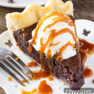 This easy, homemade Fudge Brownie Pie features a flaky, golden pie crust shell filled with the gooiest, fudgiest brownie. Serve it with ice cream & caramel sauce for the ultimate treat!