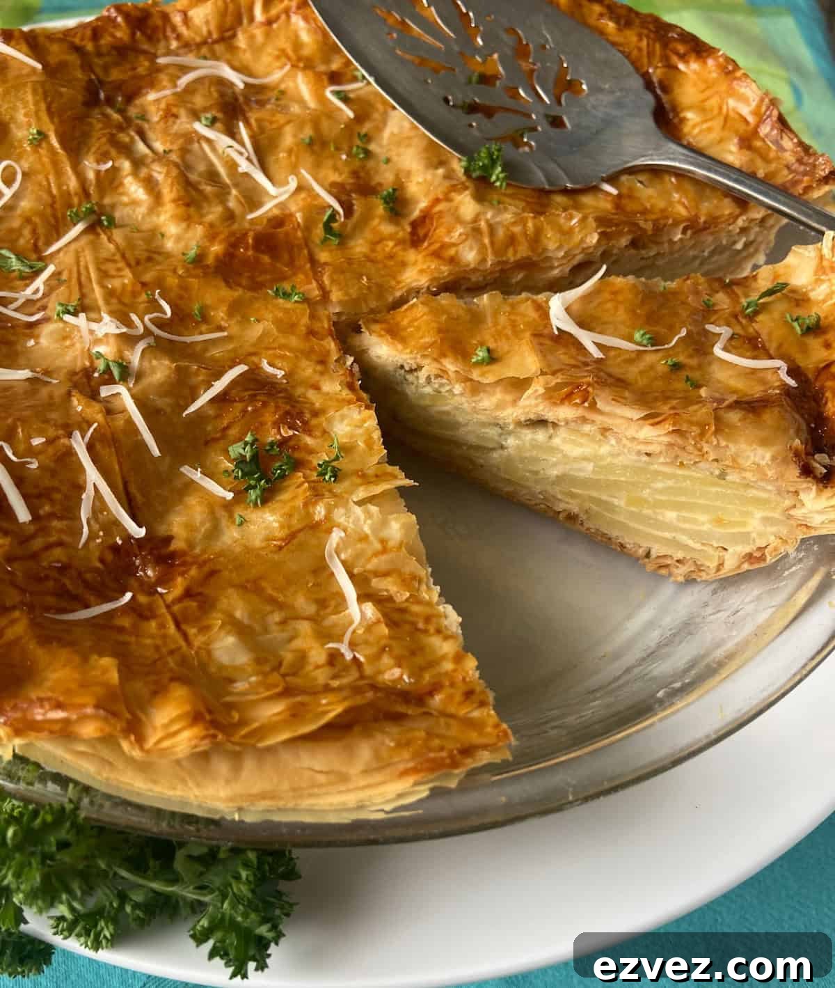 Close up image of sliced potato pie.