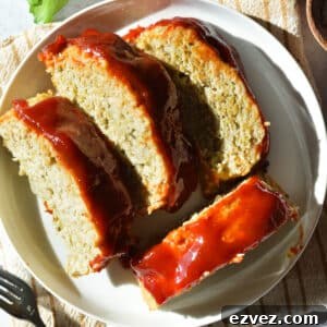 slices of chicken meatloaf on a plate.