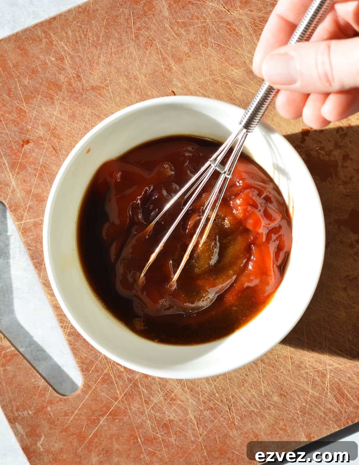 mixing ketchup glaze in bowl. 