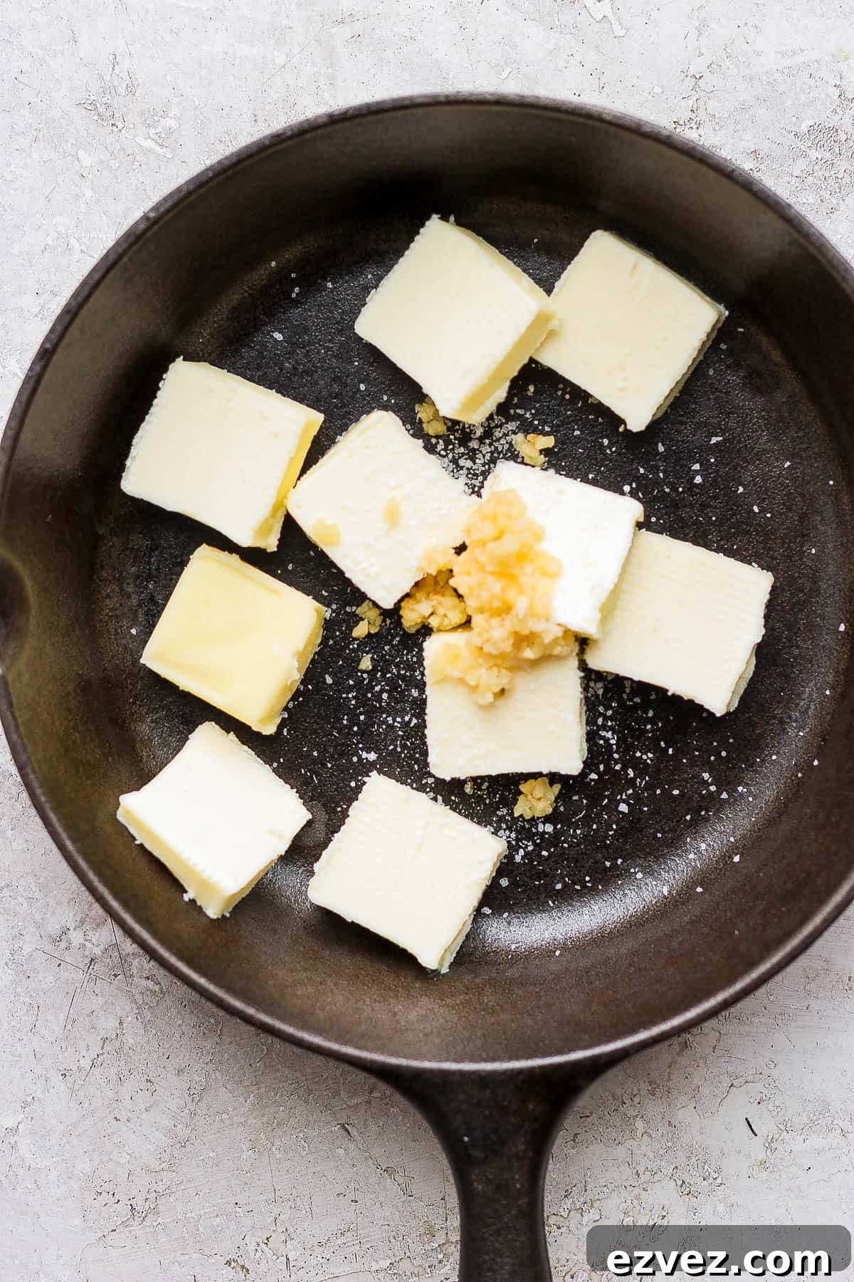 Smoked butter ingredients in a large cast iron skillet.