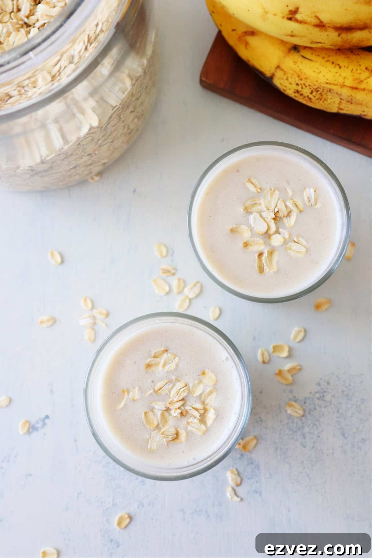 Quick Oatmeal Smoothie recipe Smoothies with oars on a white board.