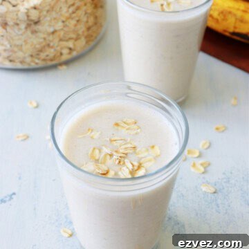 Creamy Banana Oatmeal Smoothie for Energy and Digestion 3 Two oatmeal smoothies in glasses.