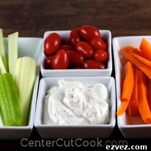 bowls of fresh vegetables and a bowl of classic ranch dip