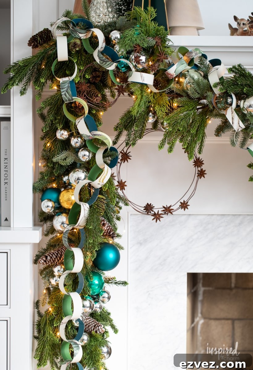 DIY Christmas Paper Chains from Wallpaper Rolls: Festive Holiday Decor 3 close up of mantel garland with diy paper chain and anise star wreath.