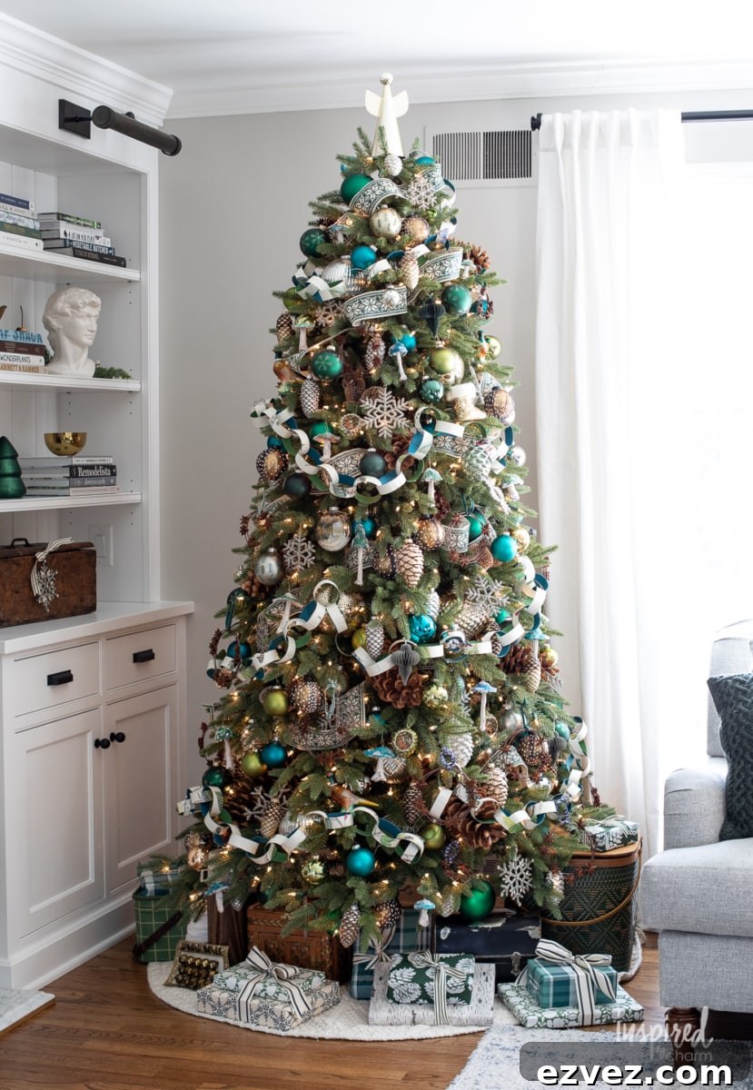 DIY Christmas Paper Chains from Wallpaper Rolls: Festive Holiday Decor 6 decorated christmas tree in front of bookcase.